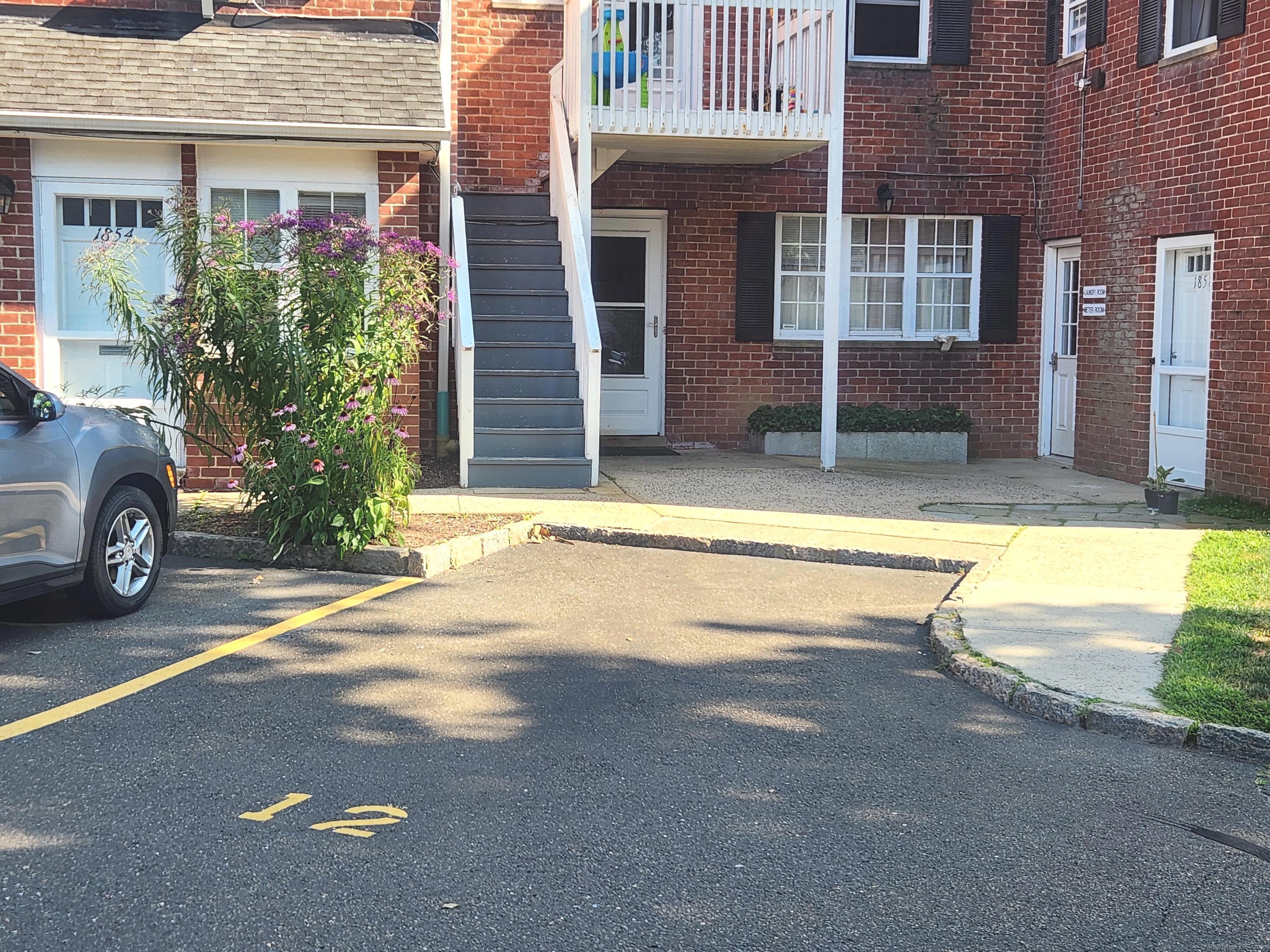 1856 Summer Street, Unit 1856 Stamford, CT 06905 - Photo 9 of 11 a view of a house with a yard