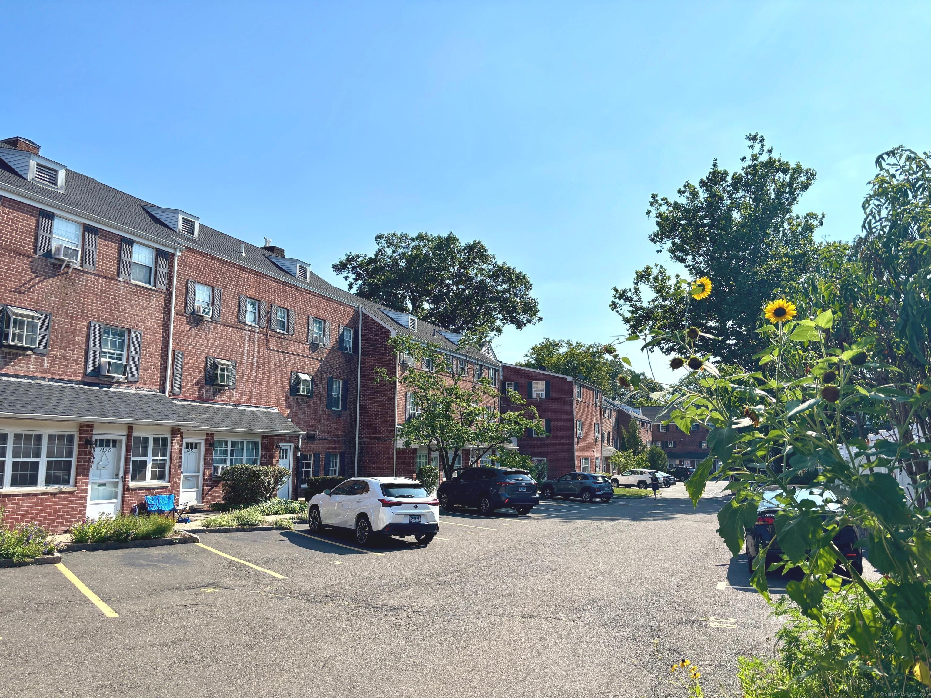 1856 Summer Street, Unit 1856 Stamford, CT 06905 - Photo 10 of 11 a car parked in front of a brick house