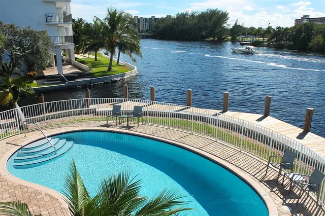 a view of a swimming pool with a patio