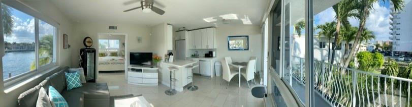 1705 North Riverside Drive, Unit 8 Pompano Beach, FL 33062 - Photo 15 of 40 a view of a living room and bathroom