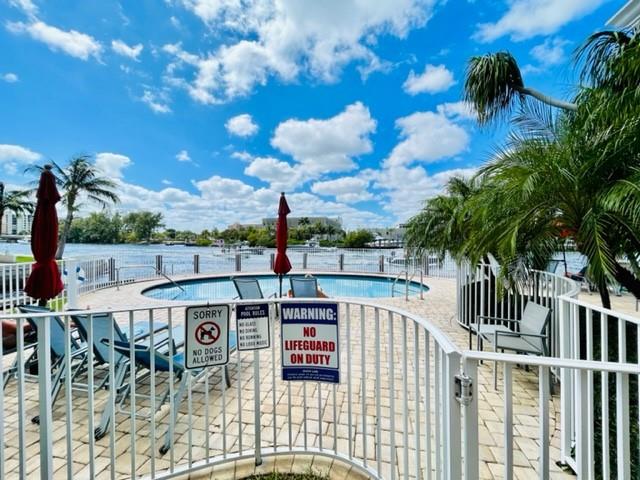 1705 North Riverside Drive, Unit 8 Pompano Beach, FL 33062 - Photo 30 of 40 a view of a chairs and table in patio