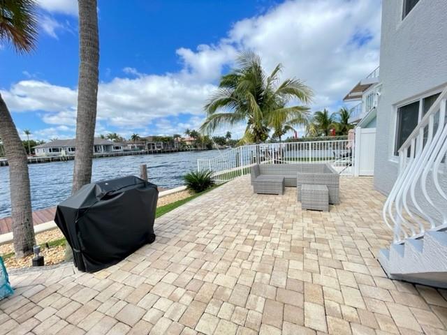 1705 North Riverside Drive, Unit 8 Pompano Beach, FL 33062 - Photo 31 of 40 a view of a roof deck with couches and wooden floor