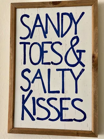 a building with street sign that is on top of it