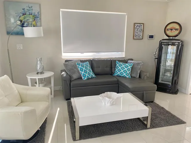 a living room with furniture and a table