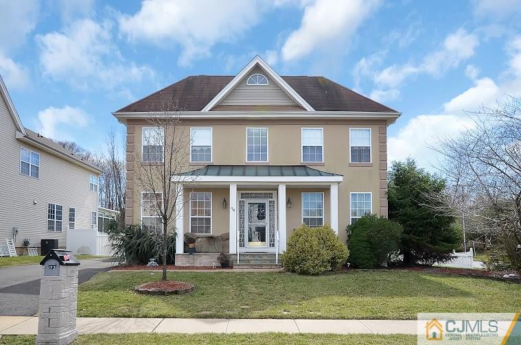 72 Timber Ridge Road North Brunswick, NJ 08902 - Photo 2 of 25 a front view of a house with a yard