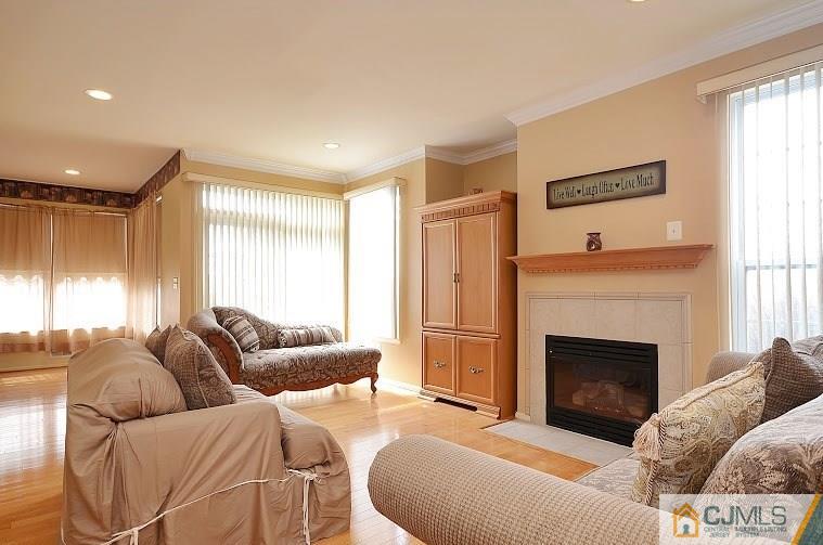 72 Timber Ridge Road North Brunswick, NJ 08902 - Photo 11 of 25 a living room with furniture and a fireplace