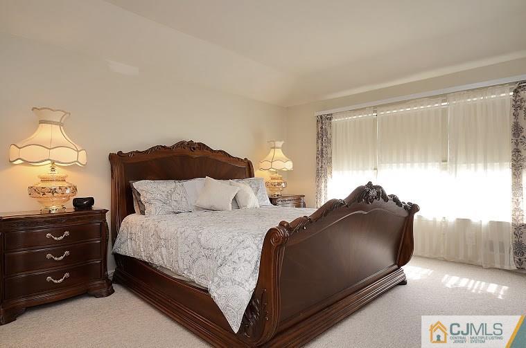 72 Timber Ridge Road North Brunswick, NJ 08902 - Photo 14 of 25 a bedroom with a bed and window