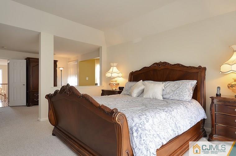 72 Timber Ridge Road North Brunswick, NJ 08902 - Photo 15 of 25 a bed room with a bed and a chair