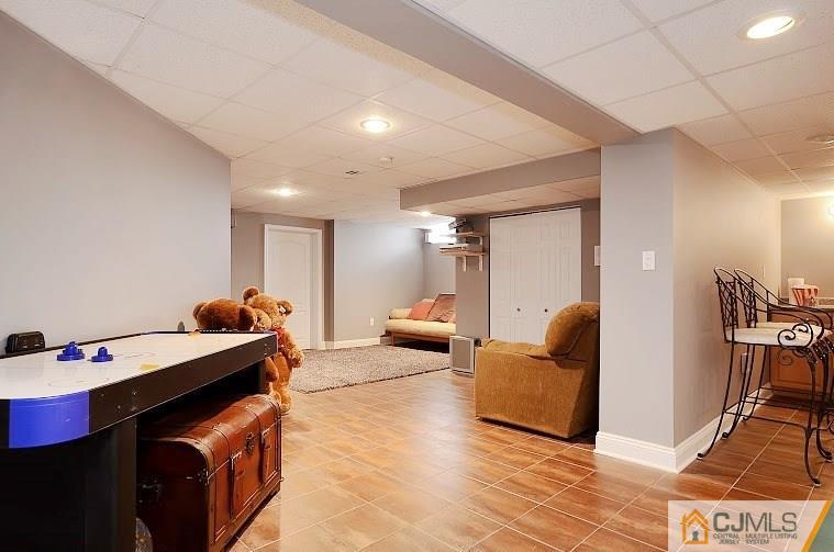 72 Timber Ridge Road North Brunswick, NJ 08902 - Photo 22 of 25 a room with furniture and a table