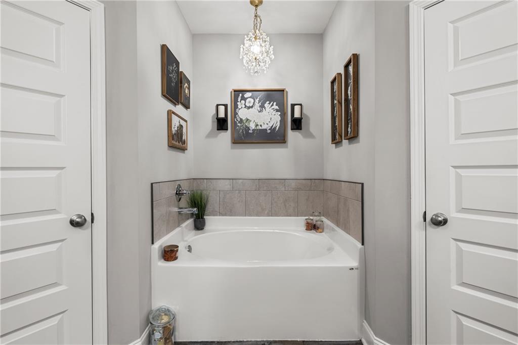 3696 Lee Road Salem, AL 36874 - Photo 23 of 36 Built-in soaking tub with a tiled surround and chrome fixtures