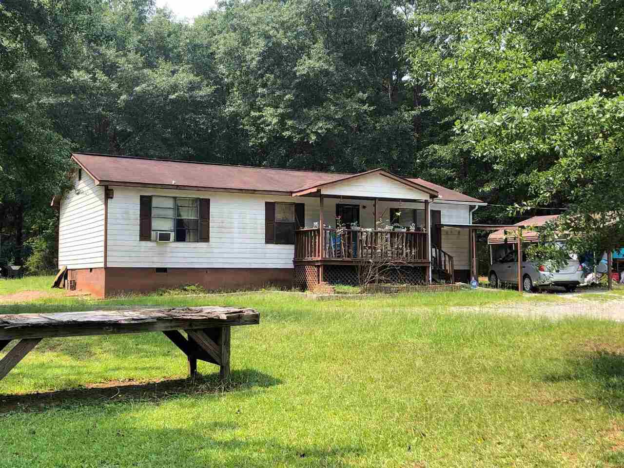 117 Shelnut Road Jenkinsburg, GA 30234 - Photo 1 of 1 a swimming pool with outdoor seating and yard
