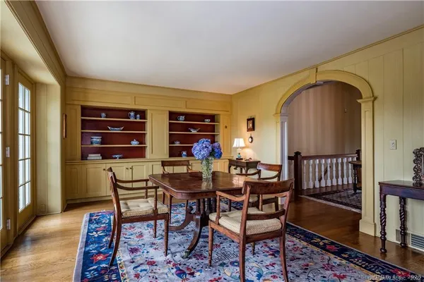 a view of a dining room with furniture and wooden floor