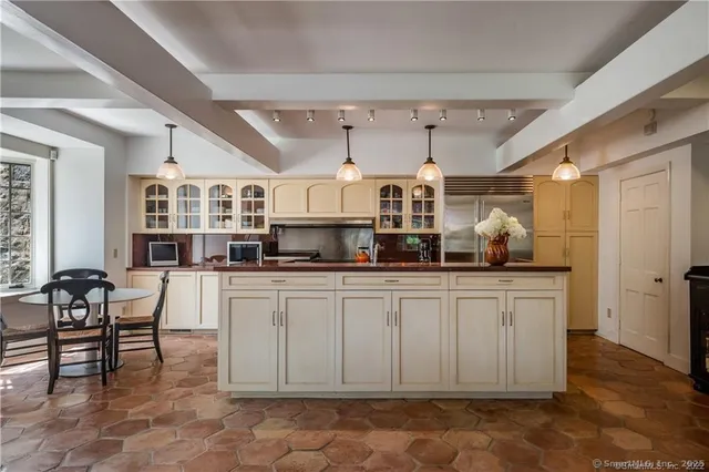a kitchen with stainless steel appliances granite countertop a sink and cabinets