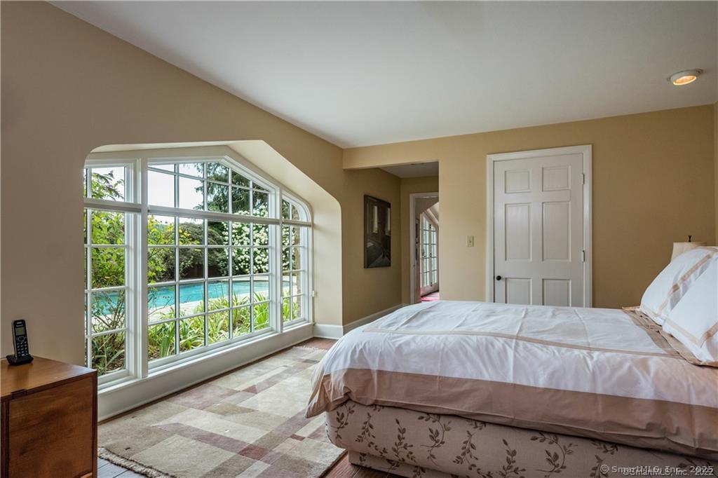 1 Neck Road Old Lyme, CT 06371 - Photo 23 of 39 a bedroom with a bed and a large window