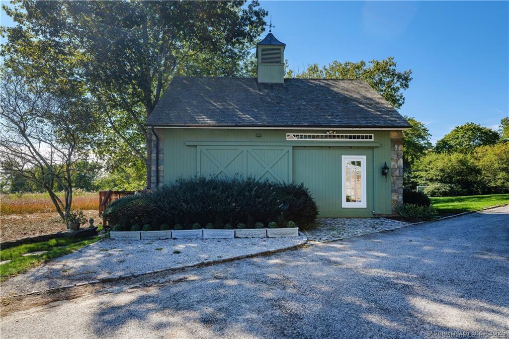 1 Neck Road Old Lyme, CT 06371 - Photo 29 of 39 a front view of a house with garden