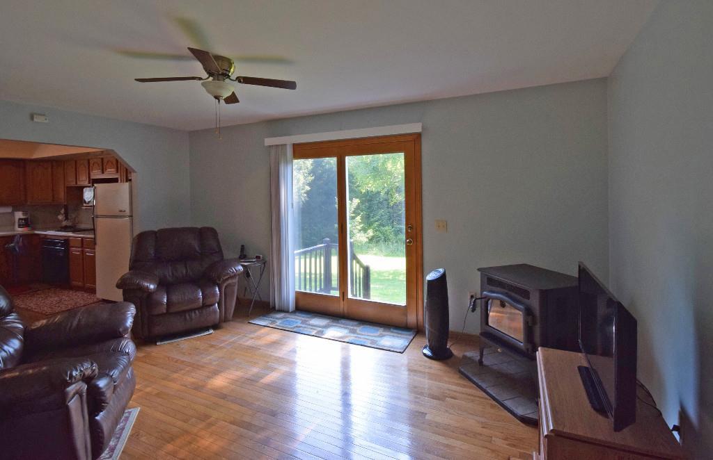 480 Bunker Hill Road Lagrange, ME 04453 - Photo 6 of 23 Living room with hardwood floors