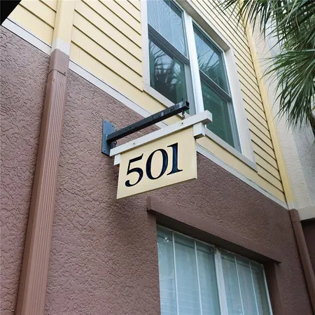 a sign broad on a brick wall