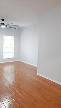 a view of a kitchen cabinets and wooden floor