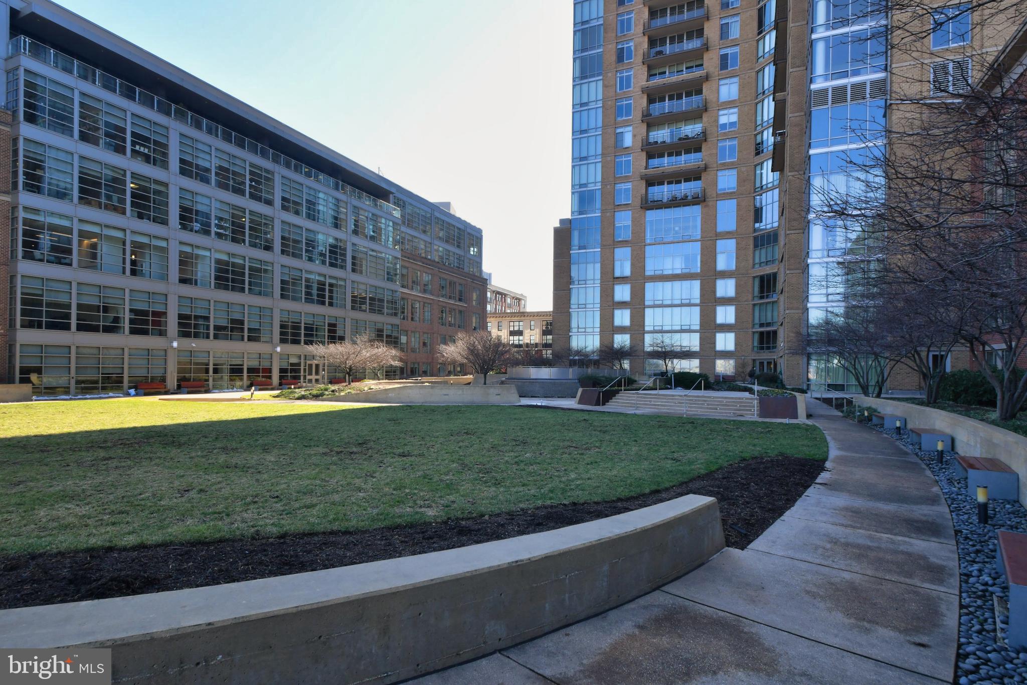 675 President Street, Unit 2207 Baltimore, MD 21202 - Photo 19 of 30 a view of a swimming pool with a garden