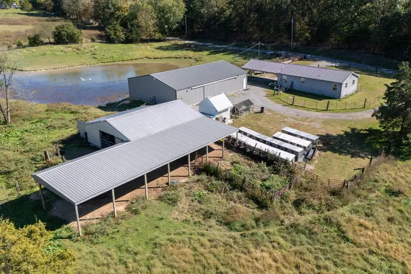 an aerial view of a house with outdoor space