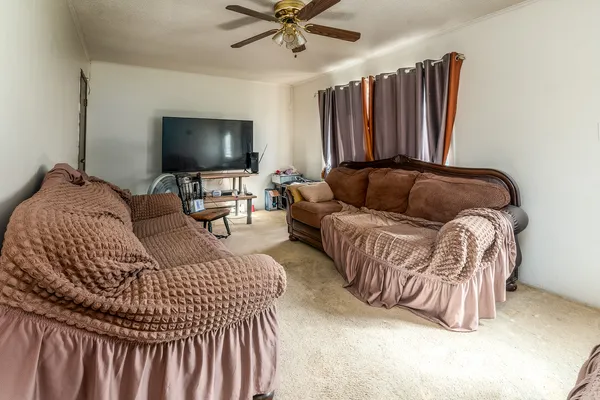 a living room with a bed