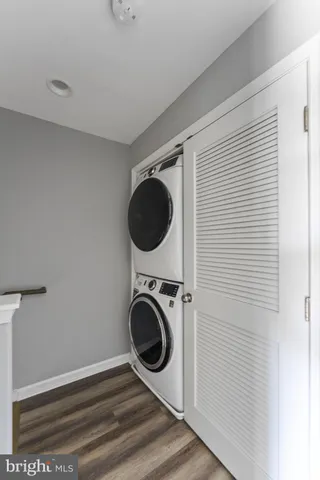 a view of a hallway with washer and dryer