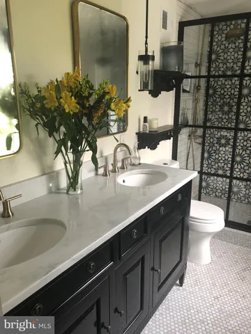 a bathroom with a sink and mirror