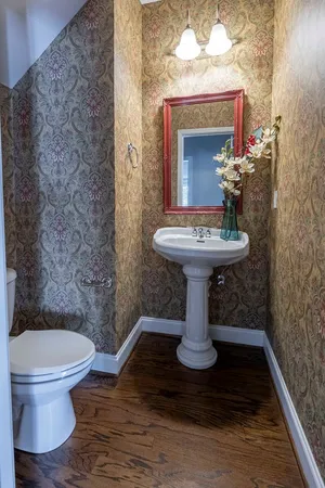 a bedroom with a bed couch and window