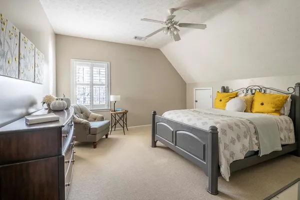 a bedroom with a bed and furniture