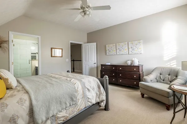 a bathroom with a toilet sink and shower