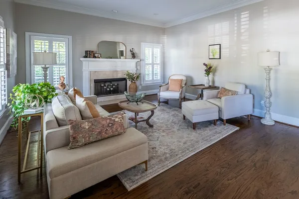 a living room with furniture and a fireplace