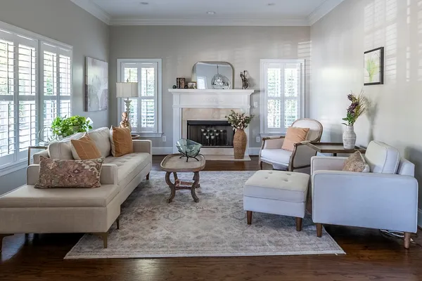 a living room with furniture and a fireplace