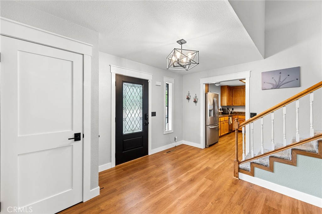 83 Gopher Road Oroville, CA 95966 - Photo 11 of 69 a view of a hallway with wooden floor and staircase