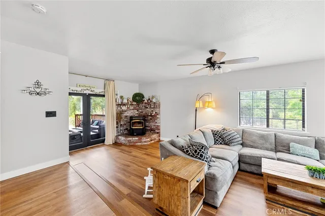a bedroom with a bed and a ceiling fan