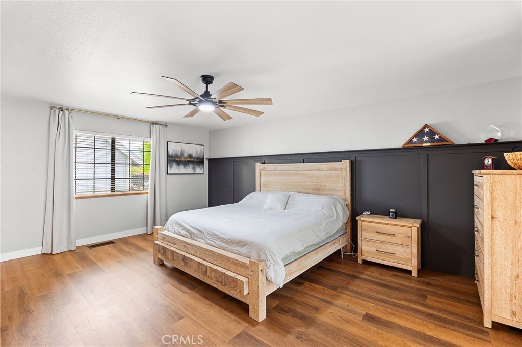 83 Gopher Road Oroville, CA 95966 - Photo 22 of 69 a bedroom with a bed and a ceiling fan