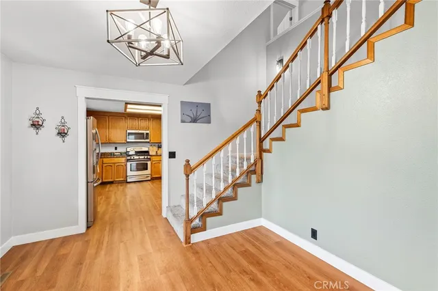 a bathroom with a granite countertop sink toilet mirror and shower