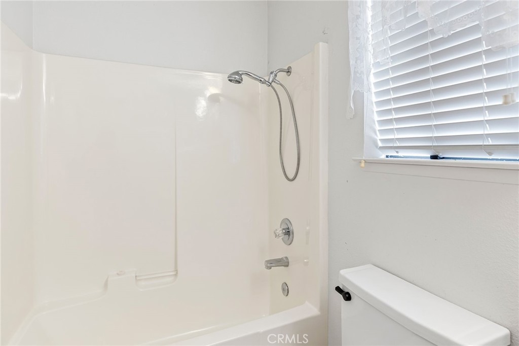 83 Gopher Road Oroville, CA 95966 - Photo 41 of 69 a bathroom with a shower a toilet and a shower