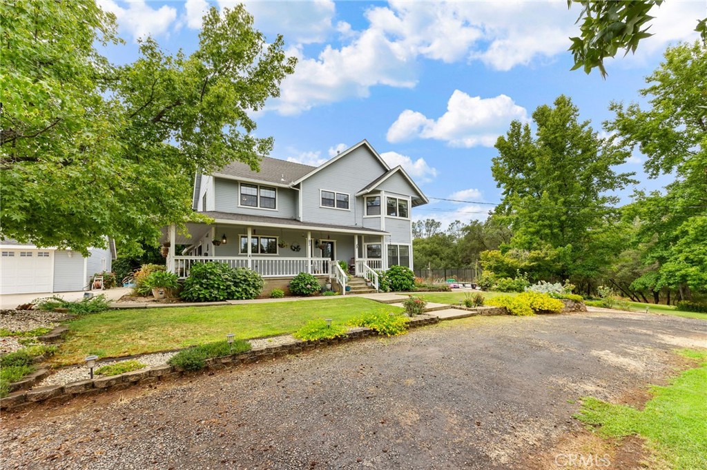 83 Gopher Road Oroville, CA 95966 - Photo 5 of 69 a front view of a house with a yard