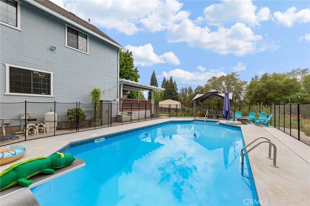 83 Gopher Road Oroville, CA 95966 - Photo 54 of 69 a swimming pool with outdoor seating and yard
