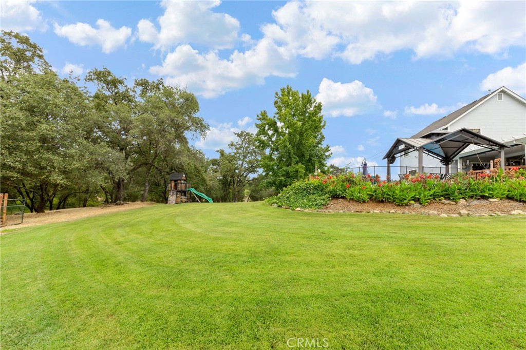 83 Gopher Road Oroville, CA 95966 - Photo 62 of 69 a view of a big yard with a house in the background