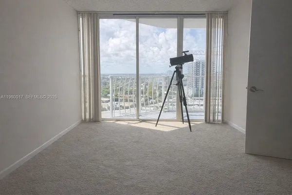 a view of empty room with windows