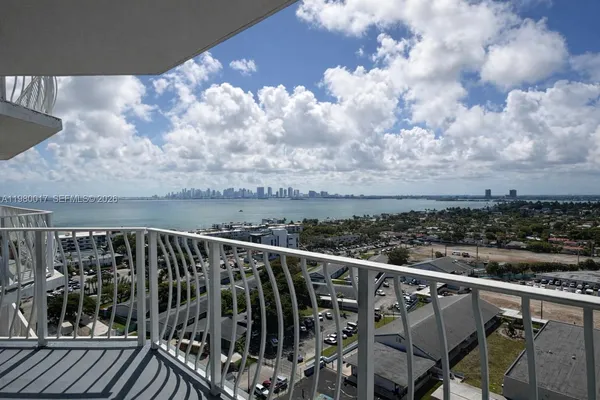 a view of a balcony with wooden floor