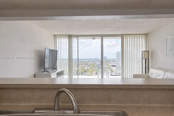 a close view of sink and mirror with window