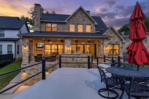 a front view of a house with garden and patio