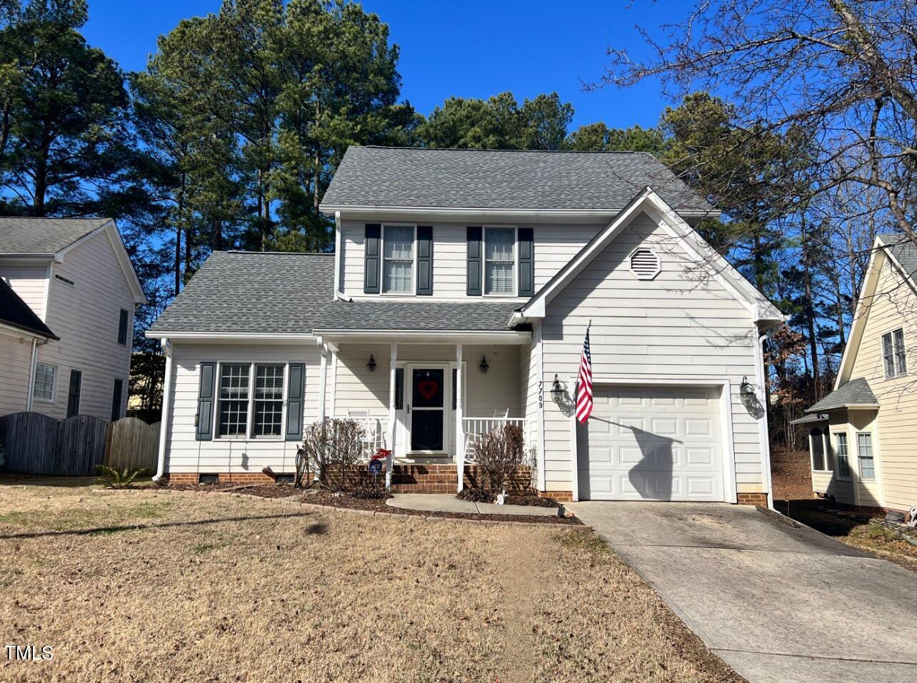 7709 Harps Mill Woods Run Raleigh, NC 27615 - Photo 1 of 15 a view of a house with a patio