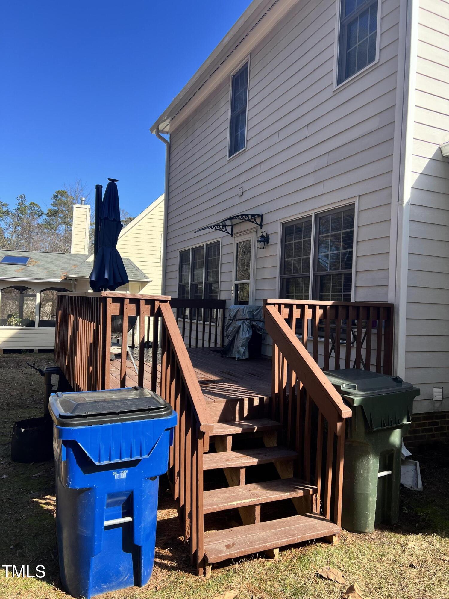 7709 Harps Mill Woods Run Raleigh, NC 27615 - Photo 14 of 15 a view of a house with wooden deck