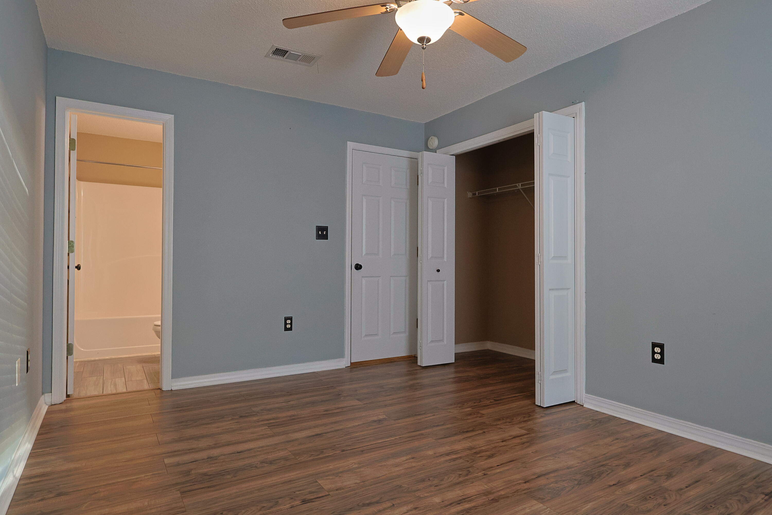 487 Keystone Road Mary Esther, FL 32569 - Photo 19 of 35 a view of an empty room with wooden floor