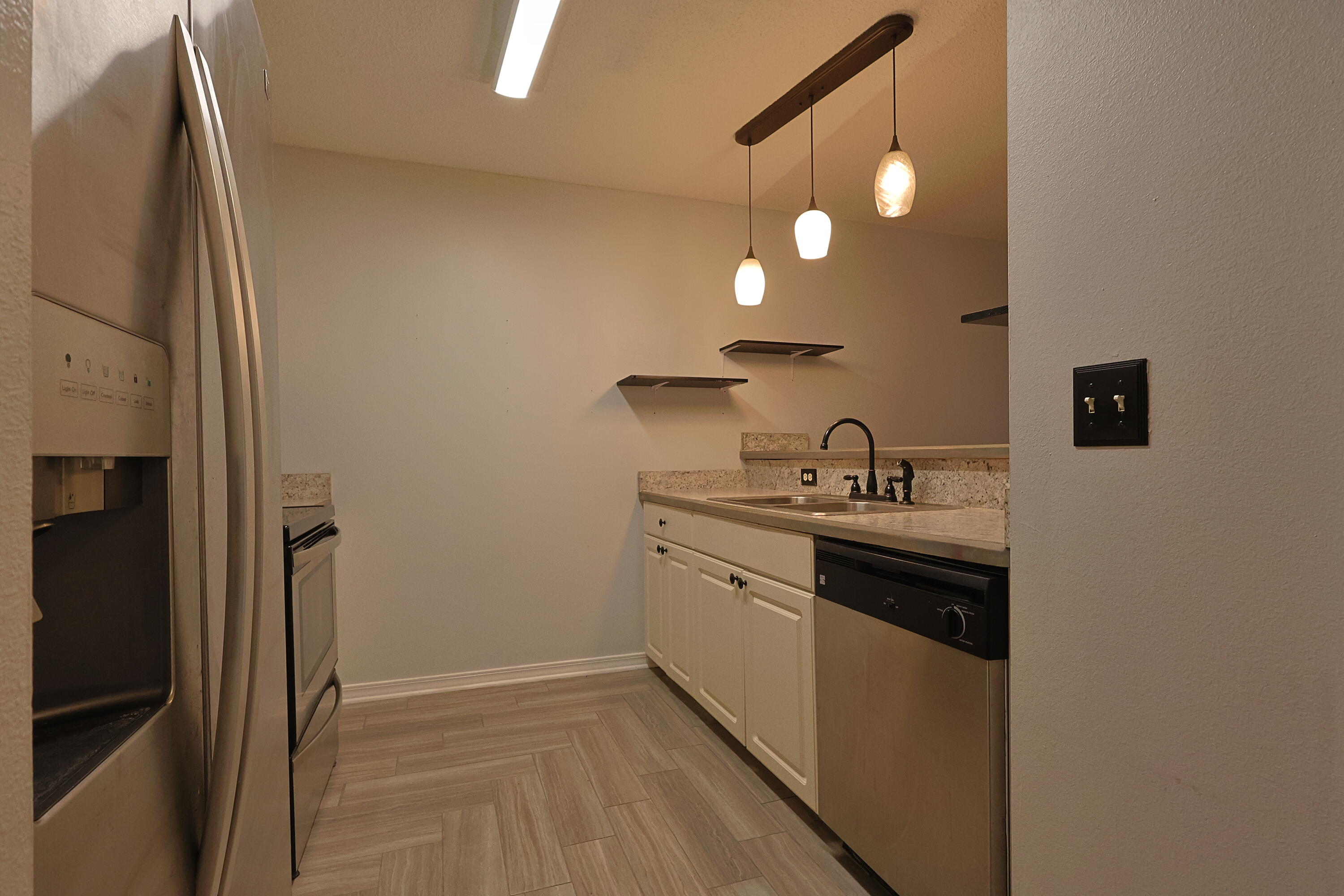 487 Keystone Road Mary Esther, FL 32569 - Photo 2 of 35 a kitchen with sink cabinets and stove