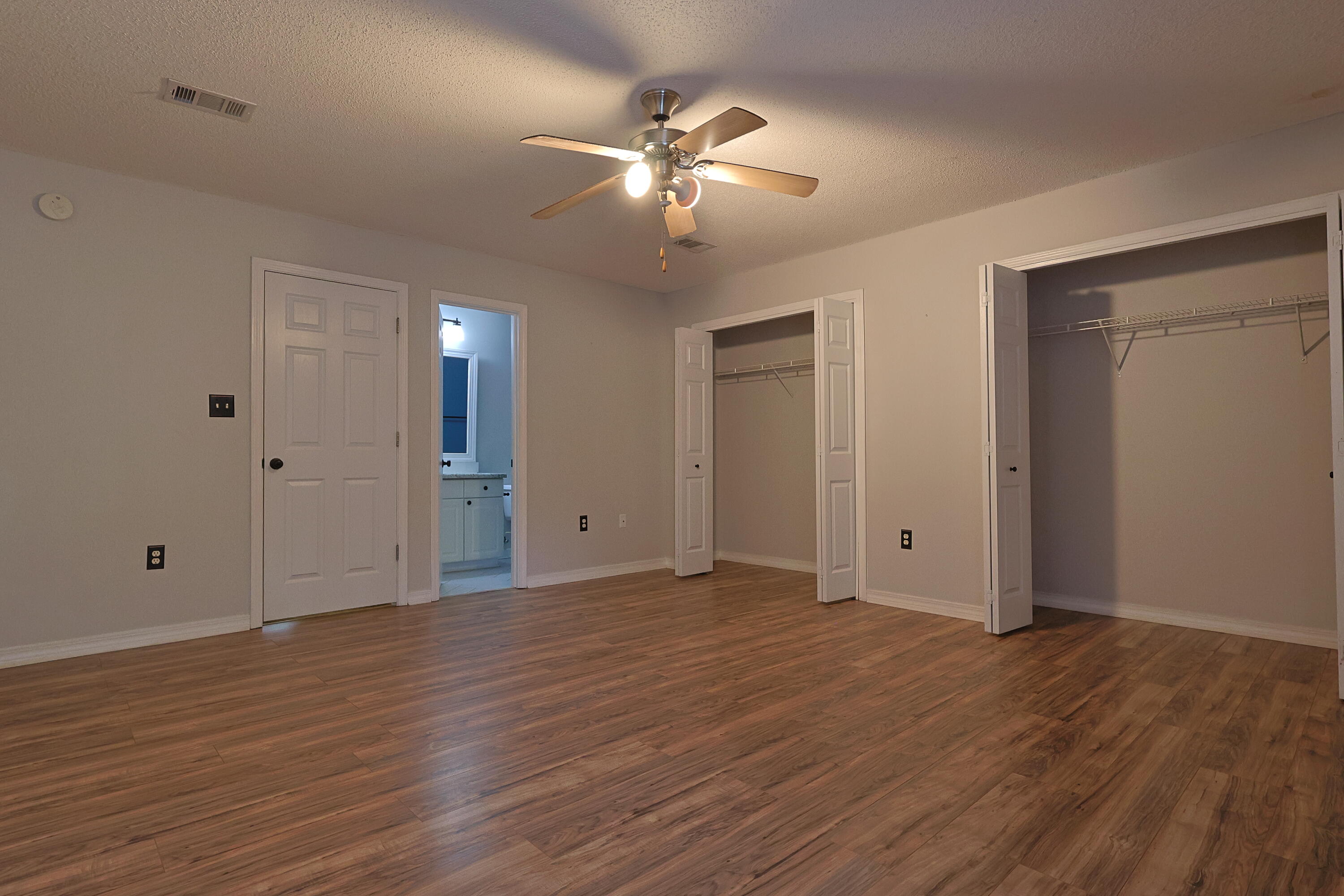 487 Keystone Road Mary Esther, FL 32569 - Photo 24 of 35 a view of an empty room with wooden floor