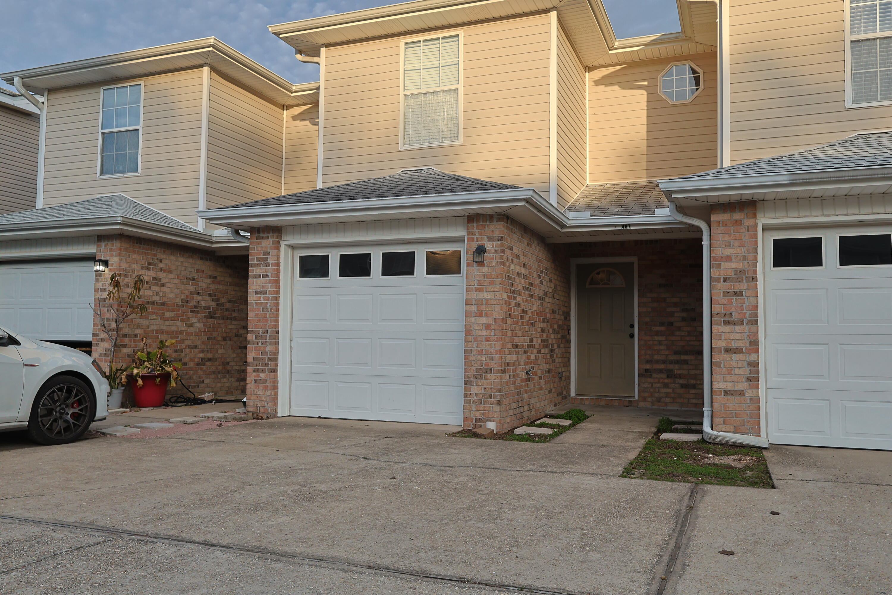 487 Keystone Road Mary Esther, FL 32569 - Photo 32 of 35 a front view of a house with a yard and a garage